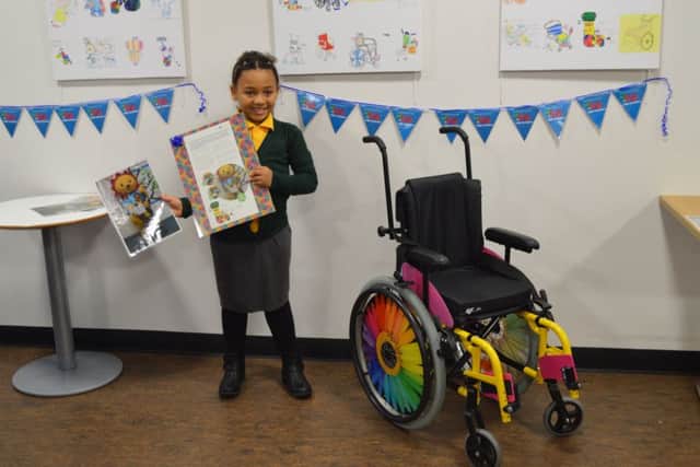 Middleton Primary pupil Ameida Alhassan with the wheelchair she designed.