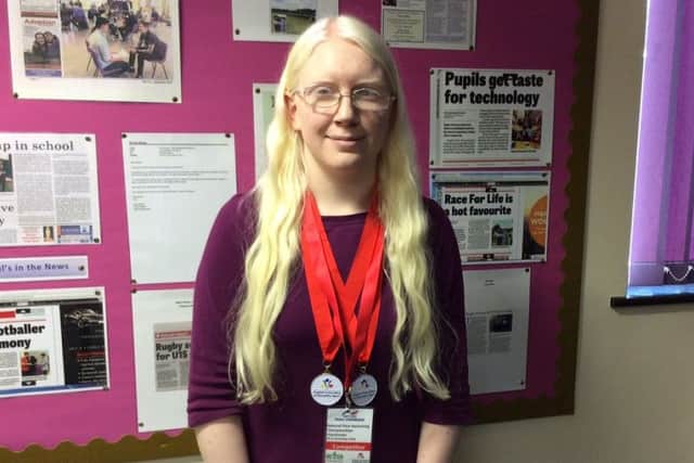 St Paul's Catholic School Student Katherine Healey with her medals