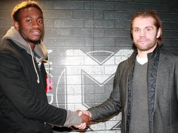 Maecky Ngombo signs for MK Dons. Pic: MKDons.com
