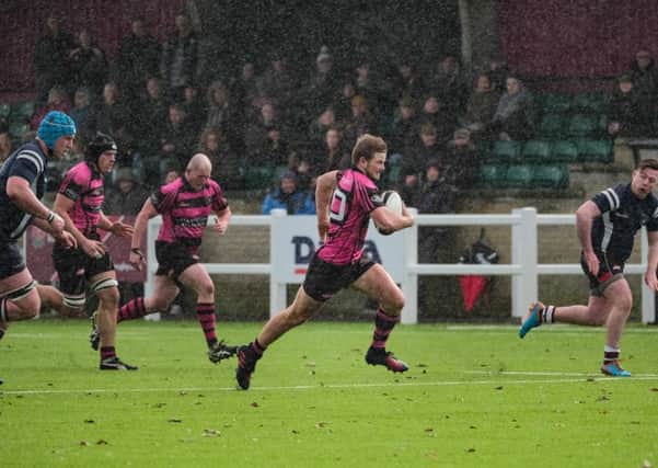 Will Travis sprints through the rain to score his third try. Aylesbury Rugby Club PNL-170130-125657002