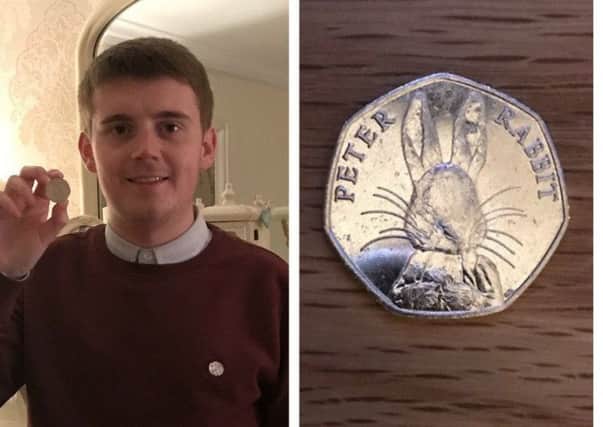 Caolán McGinley, pictured with the coin he found. DJL-170131-120057024