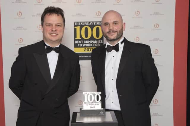 Executive manging editor of the Sunday Times, Robert Hands (L) presenting Best Companies Award to Oakman's Alex Ford