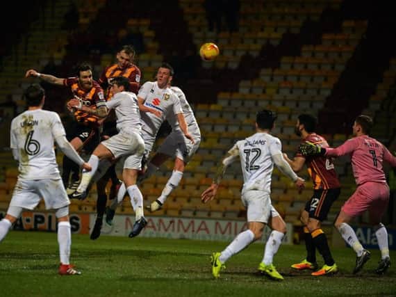 Bradford's Charlie Wyke climbed above the Dons defence to equalise at Valley Parade. Both of the Bantams' goals came from set pieces in the 2-2 draw.