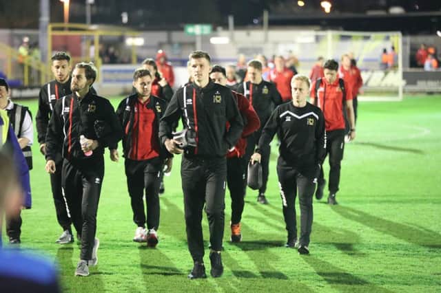 MK Dons players arrive at the stadium before the EFL Sky Bet League 1 match between AFC Wimbledon and Milton Keynes Dons at the Cherry Red Records Stadium, Kingston, England on 14 March 2017. PSI-3497-0008
