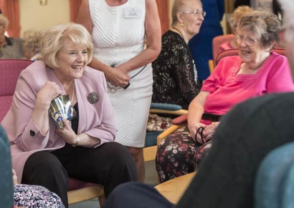 The Baroness talks to residents at Beaverbrook House