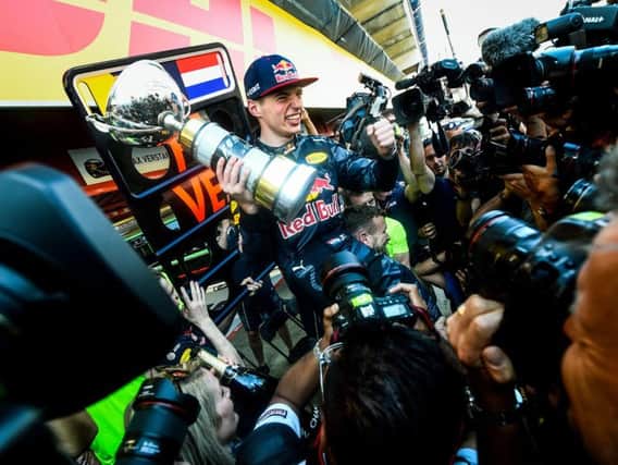 Max Verstappen celebrates his debut win last year in Spain
