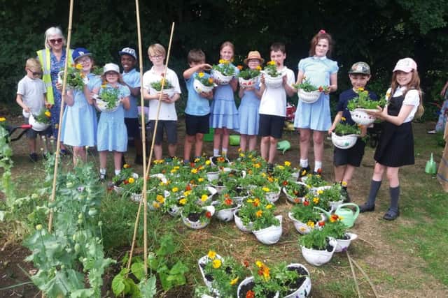 St Mary and St Giles Pupils have planted up 60 hard hats