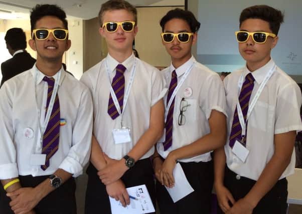 St Paul's Catholic School -students model sunglasses from their delegate packs at Faith In Action Day