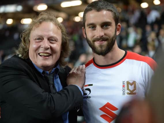 Pete Winkelman with Man of the Match Will Grigg after Dons beat Man Utd 4-0