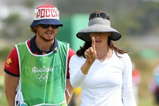 James Tobia caddying for Maria Verchenova during the Rio Olympics.