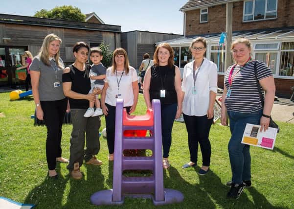 Donation to Families First Bedford.  L-R: Nicola Lee, Deputy Chief Executive FFB, Sonia Masciopinto and son Ashton,15 months, Mandy Conlon, Specialist Services Manager, Lauren Conneely,   Ilona King  and Andrea Tronca of Amazon