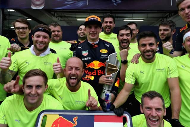 Verstappen celebrates with his team