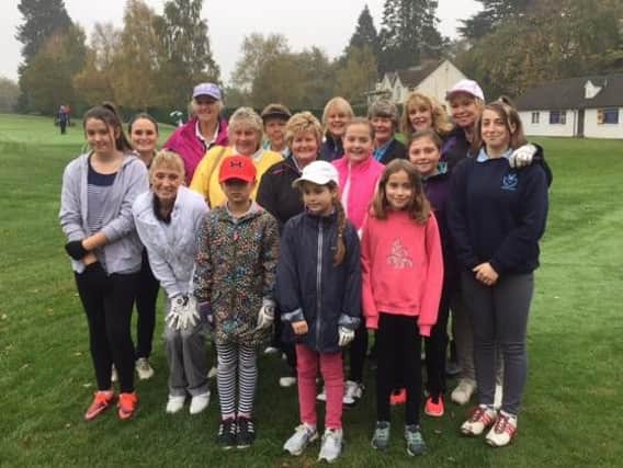 Gill Ladd pictured (middle centre) with other volunteer helpers and Leightons growing squad of young female golfers.