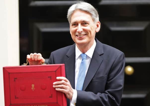 Chancellor Philip Hammond holding his red ministerial box outside 11 Downing Street, London, before heading to the House of Commons to deliver his Budget. PRESS ASSOCIATION Photo. Picture date: Wednesday November 22, 2017. See PA story BUDGET Main. Photo credit should read: Yui Mok/PA Wire BUDGET_Main_112733.JPG